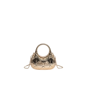 Detail of golden acrylic evening bag with geometric triangle pattern and metal chain