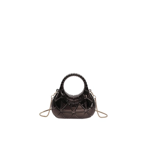 Detail of metallic bronze acrylic box bag with 3D geometric texture and gold chain