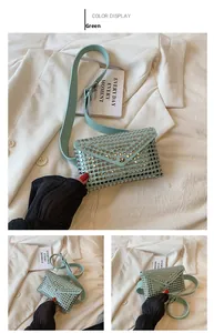 Detail of green PU leather waist bag with punk style silver studs and envelope flap
