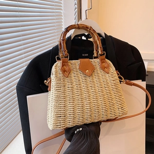 Retro straw handbag with bamboo handle and brown leather trim for summer beach vacation