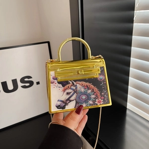 Golden mirror finish handbag with unicorn print and metallic handle for women