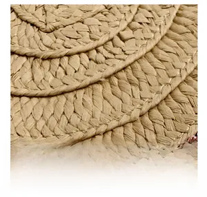 Macro shot of natural straw weaving layers showing detailed texture and beige fibers