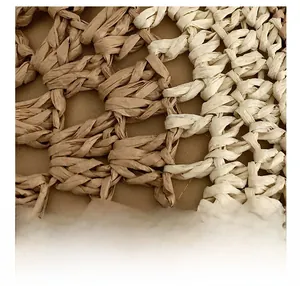 Macro view of woven straw bag detail showing the intricate diamond mesh craftsmanship