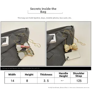 Detailed size chart of the gold bow acrylic clutch with 14cm width and chain strap