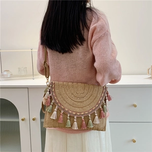 Bohemian handmade straw woven crossbody bag with colorful tassels and wave embroidery
