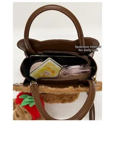 Detail view of plush bear bag interior with large capacity and zip closure