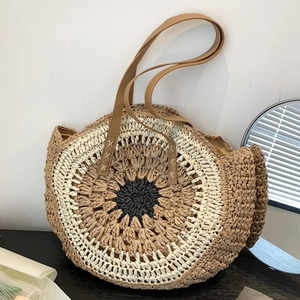 Large circular woven straw shoulder bag with tricolor sunburst pattern and faux leather straps