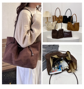 Detail view of suede tote bag interior showing large capacity for tablet and cosmetics