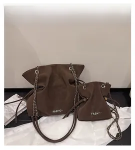 Deep brown bucket bag set with chain strap and elegant drawstring pleated design
