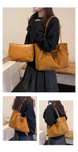 Detail of caramel tote bag set with matching inner pouch and drawstring metal ball charm