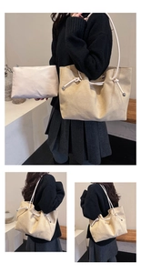 Detail view of beige suede tote bag with drawstring ropes and matching zipper pouch