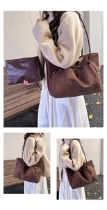 Detail of vintage brown suede tote bag with leather inner pouch and slim straps