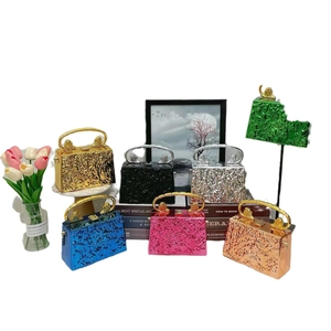 Acrylic evening bags with ice-cracked texture and lion head handles in seven metallic colors