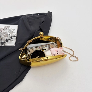 Elegant gold metallic shell evening bag with a spherical clasp and fine chain strap