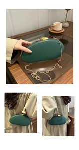 Detail of dark green acrylic PU clutch bag with gold chain strap for party evening wear