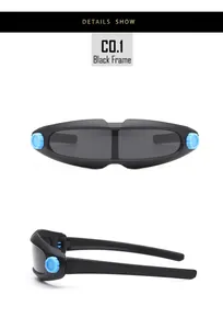 Detail view of futuristic kids sports sunglasses with matte black frames and blue gear accents