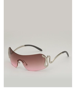 Detail of silver snake emblem on gradient pink rimless oversized sunglasses frame