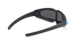 Detail of matte black sports sunglasses with grey lenses and blue adjustment dial