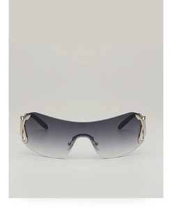 Detail of rimless shield sunglasses with silver snake-shaped metal temples and gradient lens