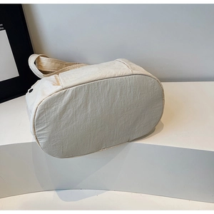 Top-down view showing the wide rectangular base and smooth fabric of this tote bag