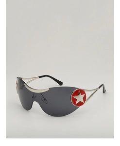 Detail of Y2K shield sunglasses showing silver star rivets and red circular accents