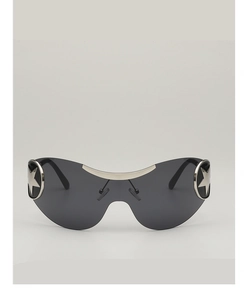 Macro detail of Y2K shield sunglasses with silver star emblems and sleek metal bridge