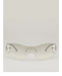 Detail of Y2K pilot sunglasses with oversized gray lenses and star metal accents