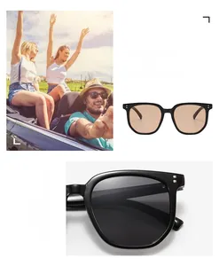 Close-up of irregular tawny sunglasses with silver rivet detail and UV lenses