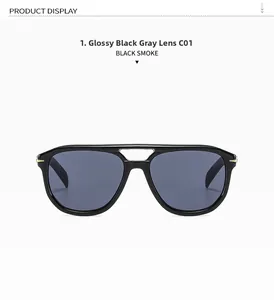 Close-up of oversized aviator sunglasses with bright black frame and smoke lenses
