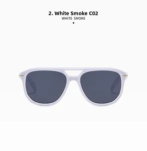 Detailed view of white aviator sunglasses with gold metal hinges and smoke gray lenses