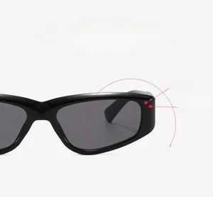 Detail of vintage cat-eye sunglasses with thick black frames and dark grey lenses