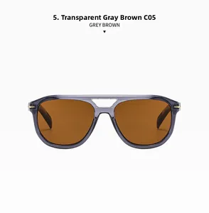 Detail of pilot-style double bridge sunglasses with transparent grey frames and brown lenses