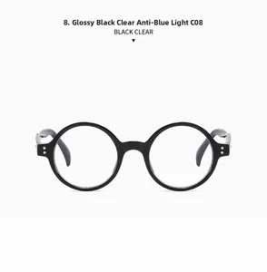 Détail de lunettes rétro rondes noir brillant avec verres anti-lumière bleue et accents argent