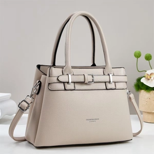 Elegant beige lychee grain leather handbag with top handle and adjustable shoulder strap