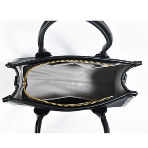 Top view of large black tote bag interior with gray lining and gold zipper details