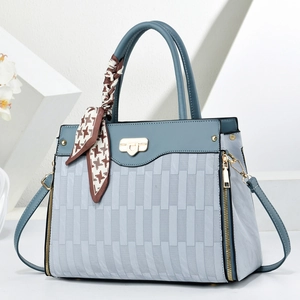 Light blue faux leather shoulder bag with houndstooth silk scarf and gold hardware