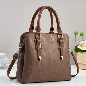 Brown textured women's handbag with gold accents and detachable shoulder strap