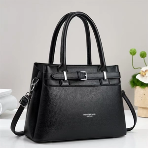Detail of classic black litchi pattern leather texture on stylish women handbag