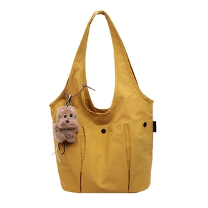 Mustard yellow canvas tote bag with multi-pocket design and cute puppy pendant