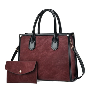 Deep red tote bag set with matching small wallet and gold-tone hardware on white background