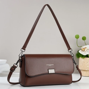 Classic dark brown pebble leather shoulder bag with metallic lock and dual straps