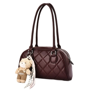 Classic burgundy quilted shoulder bag with chic bear charm and elegant leather texture