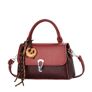 Vintage burgundy crossbody bag with a woven texture finish and elegant silver metal buckle