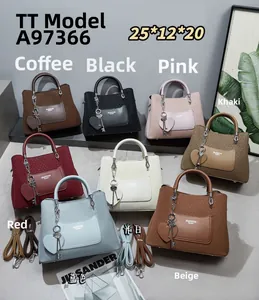 Detail view of woven texture tote bags in eight colors with heart-shaped pendants