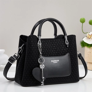 Fashionable black knit and leather handbag with Queen print and metal heart key charm