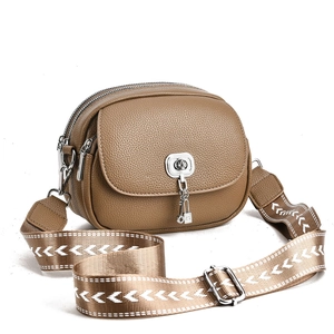 Brown lychee leather crescent crossbody bag with stylish patterned strap and silver lock
