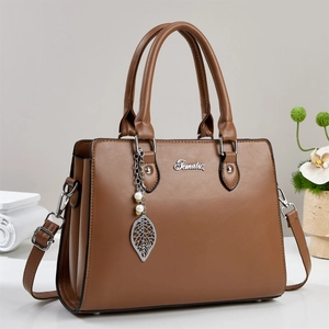 Classic brown large capacity tote bag with adjustable shoulder strap and leaf charm