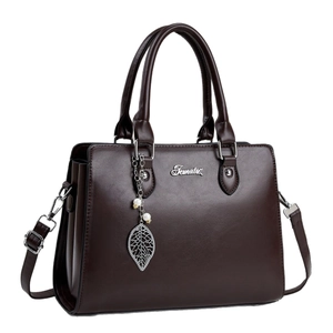 Elegant dark brown tote bag with metallic logo and decorative leaf pendant with pearls