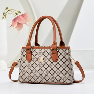Retro monogram canvas tote bag with brown leather handles and gold metal accents