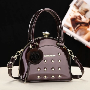 Elegant wine red patent leather handbag with gold studs and crystal clasp for women